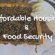 Beekeeper holding a bee frame with bees and honey on it